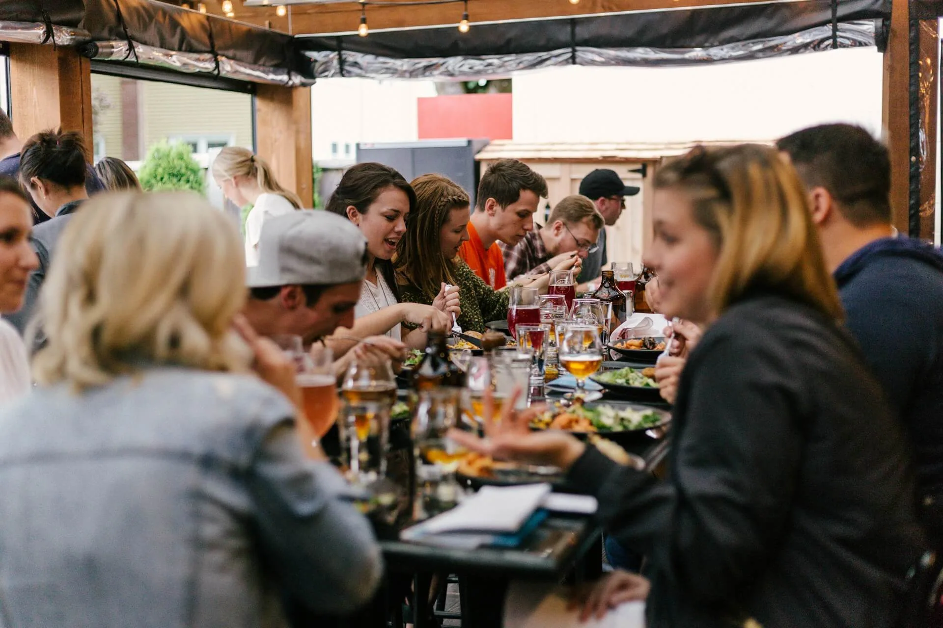 Diners eating together at a busy restaurant table