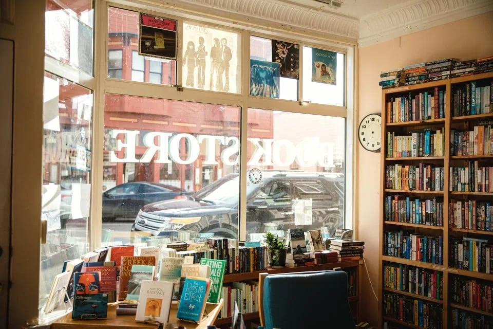 Bookstore interior with bookshelves and display tables
