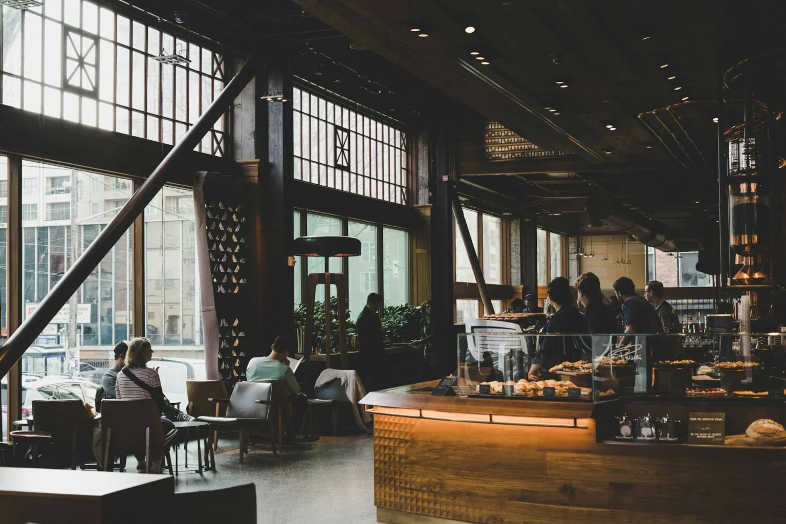 Customers seated inside a spacious modern cafe