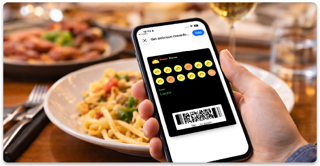 Customer holding a digital restaurant loyalty card on a smartphone
